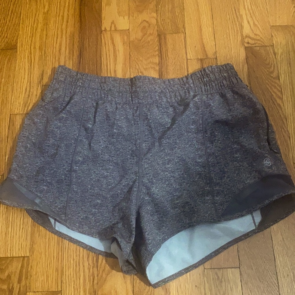 Gray athletic shorts with mesh detailing